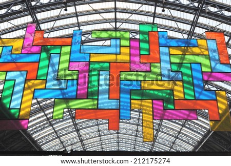 LONDON - AUGUST 9. A giant stained glass mural designed by David Batchelor on August 9, 2014 measures 20 x 10 metres (66 x 33 feet) suspended at St Pancras International rail station, London.