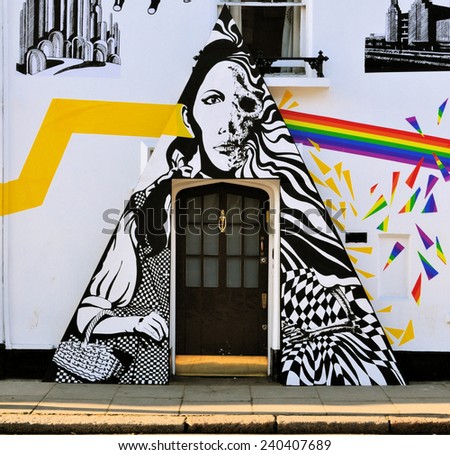 LONDON - DECEMBER 6. Street art at Chelsea Arts Club doorway based on Pink Floyd\'s The Dark side of the Moon album and synchronicity with the film The Wizard of Oz; December 6, 2014; Chelsea, London.