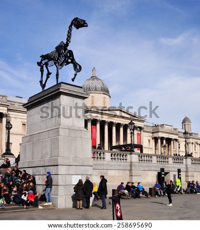 LONDON - MARCH 6, 2015. Hans Haacke's Gift Horse statue has an electronic ribbon displaying the Stock Exchange live ticker on temporary display on the fourth plinth in Trafalgar Square, London.