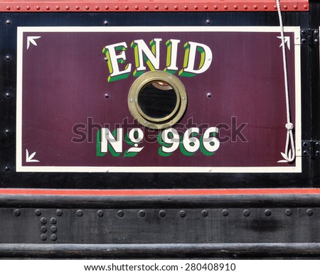 RICKMANSWORTH, UK - MAY 16, 2015. Hand painted shadow lettering on a narrow boat mooring at the Grand Union Canal at the town festival in Rickmansworth, England, UK.
