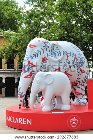 LONDON - JUNE 26, 2015. A decorated 10 feet model elephant with its baby ; the subject of a design competition to save the Asian Elephant from extinction, located at Duke of York Square, London, UK.
