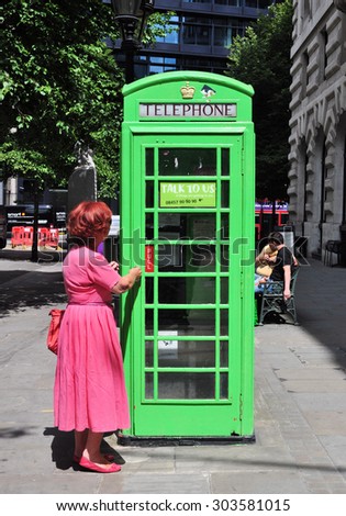 LONDON - JULY 11, 2015. An iconic British K6 telephone box, no longer in use, repainted green and now used for advertising purposes at Royal Exchange Buildings, Cornhill Street, London, UK.