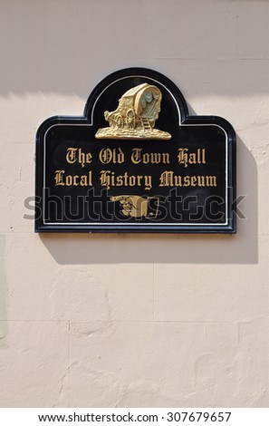 MARGATE, UK - AUGUST 15, 2015. A directional wall sign for the town museum in the English coastal town of Margate, Kent, UK.