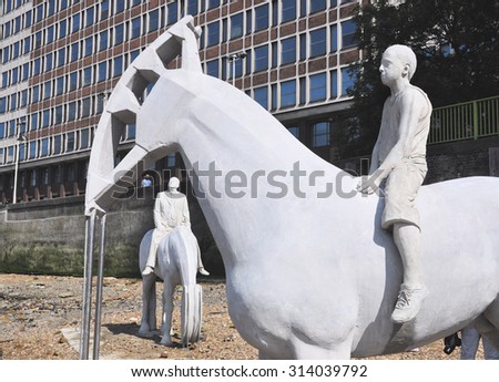 LONDON - SEPTEMBER 6, 2015. Horse sculptures by Jason deClaires Taylor designed as a political and environmental warning with oilwell pump heads, located at the river Thames in London, UK.