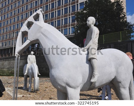 LONDON - SEPTEMBER 6, 2015. Horse sculptures by artist Jason deClaires Taylor designed as a political and environmental warning with oil well pump horse heads, located at the river Thames in London.