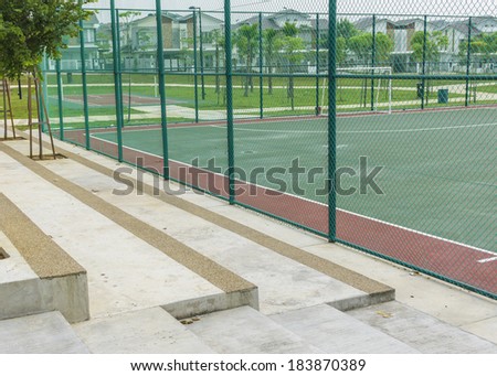 Concrete bench for spectators at futsal court.