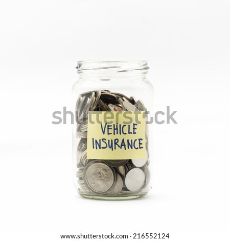 Isolated coins in jar with vehicle insurance label - financial concept