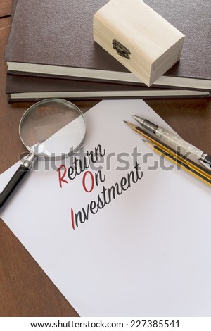 Return Of Investment word on plain paper