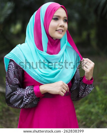 Portrait of young beautiful Asian muslim woman wearing hijab.