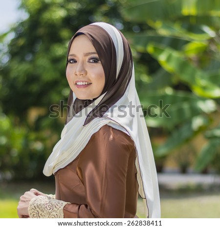 Close up of young beautiful Asian muslim woman wearing hijab.