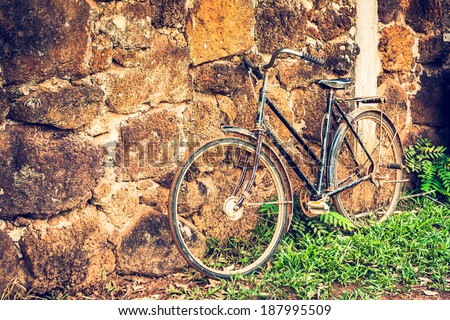 Old retro bicycle and brick wall