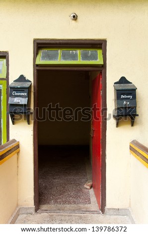 Red door with mail boxes