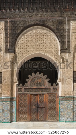 The craft wooden door of Bau Inania Merdasa in Fes, Morocco
