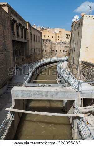 The under construction walkway along the canal through the medina in Fes, Morocco