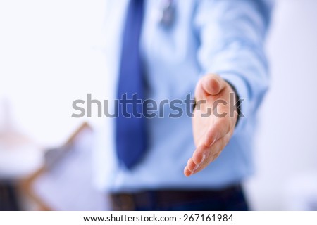A male doctor giving his hand for a handshake