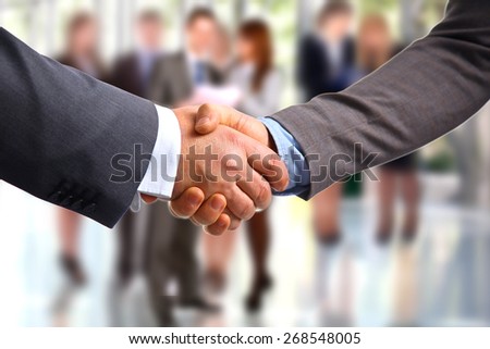 Closeup of a business handshake, on white background