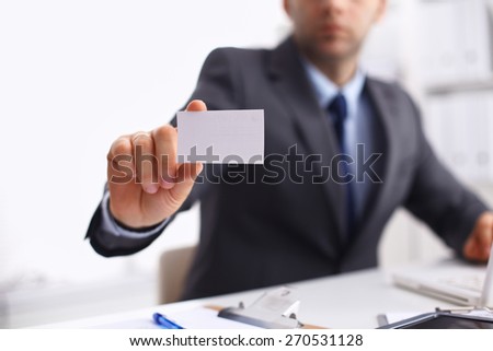 Man's hand showing white  business card