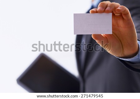 Man\'s hand showing business card