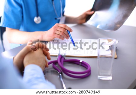 Doctor and patient sitting on the desk
