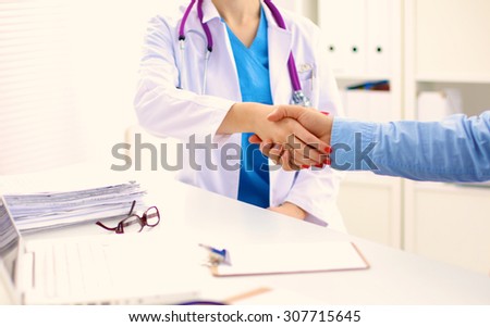 doctor with stethoscope on the patient\'s admission at the table