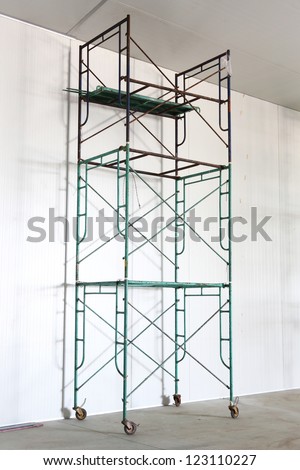 Iron scaffold with wheel in warehouse