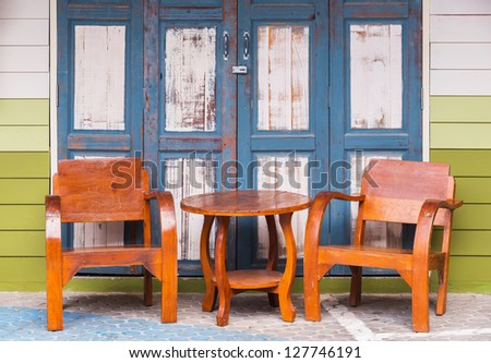 Old and grunge wood chairs and wood wall