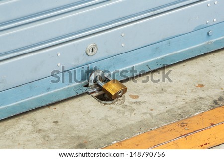 Close up shutter door with key locked of car garage