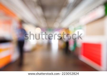 Abstract blurred people walking or standing in train station