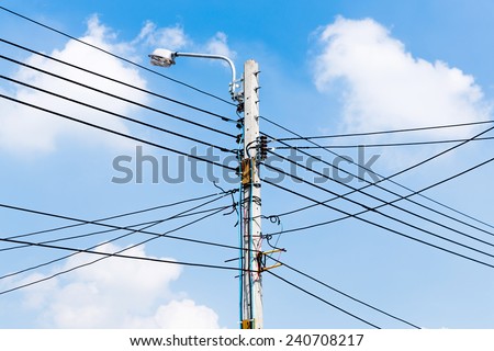 Electricity power wire and street lamp on concrete pole with blue sky