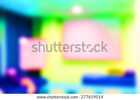 Blurred seminar room with blank projector screen, education concept