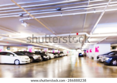 Abstract blurred car in parking lot of office building