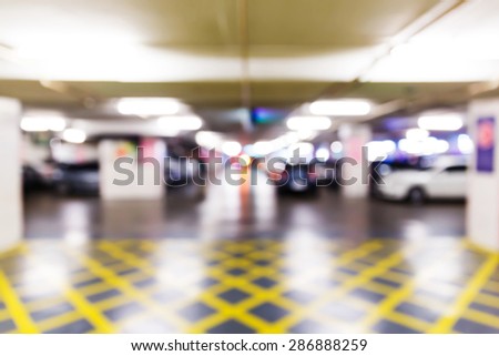 Abstract blurred car in parking lot of office building