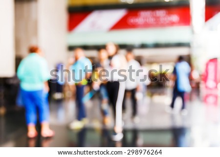 Abstract blurred people in office building, business concept