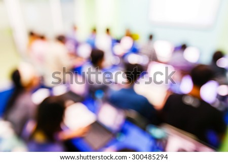 Abstract blurred people in seminar room, education concept