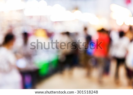 Abstract blurred people shopping in department store, urban lifestyle concept