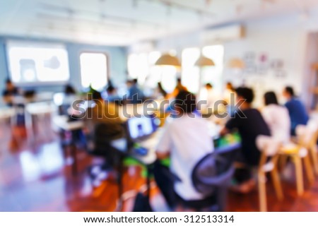 Abstract blurred people doing workshop in training room, education concept