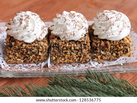 Cake with nuts and whipped cream