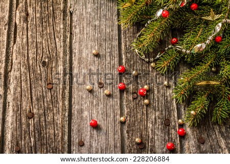Rustic Christmas Background - Aged Barn Wood with Pine Tree Branch, Garland & Beads