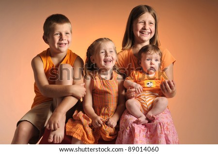 portrait of four siblings