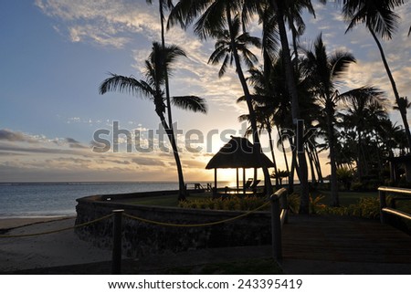The tranquil beaches of the  South Pacific Ocean really are paradise found. This sunset is over the Coral Coast on the island of Viti Levu (Fiji)