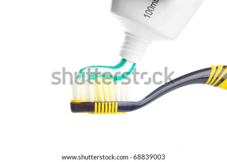 Tooth-brush with tooth paste on white background