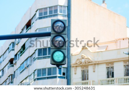 Green traffic light in the city