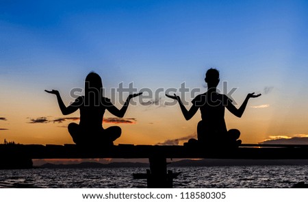 Silhouette of  beautiful Yoga woman