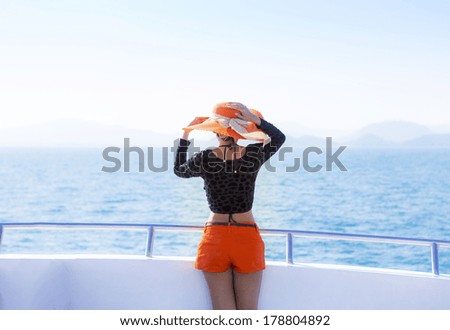 Woman relaxing on speed boat, Krabi Thailand
