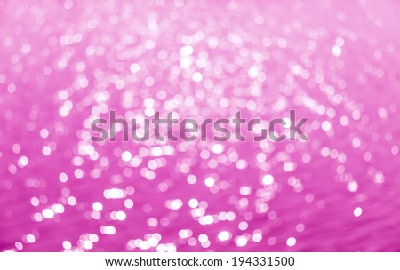 Abstract circular bokeh background of Light shining on the river, Abstract river shot in manual mode out of focus. Pink color.