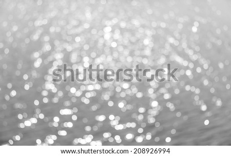 Abstract circular bokeh background of Light shining on the river, Abstract river shot in manual mode out of focus.Gray color.