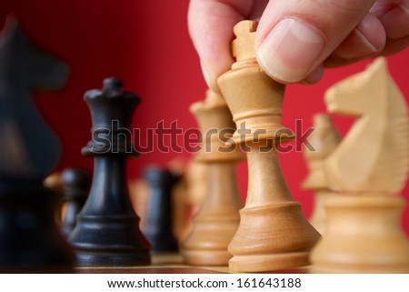 Moving the King in a Game of Chess. Focus is on the Hand with King.