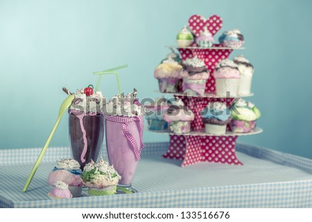 are smoothies and cupcakes with cream with the style of the sixties