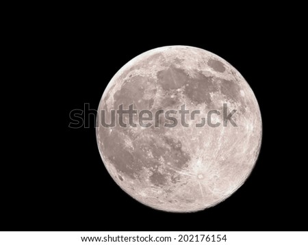 Big and bright full moon.Close-up of moon against black night sky.