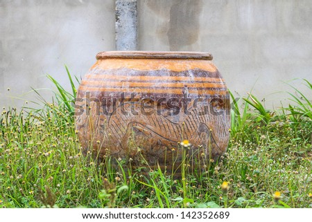 Jar for storing water for use placed in the lawn